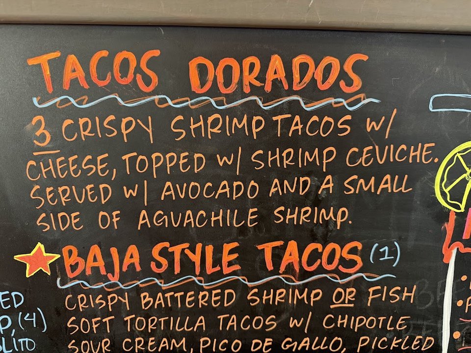 Printed menu with mariscos, drinks, and hot food.
